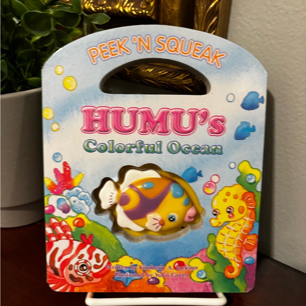 HUMU's Colorful Ocean Peek 'N Squeak Toy hardcover book